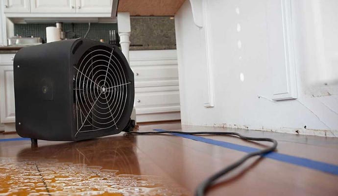 air dehumidifiers kitchen floor white wall water damage restoration equipment service