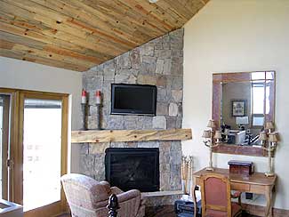 Living Area with large stone fireplace.